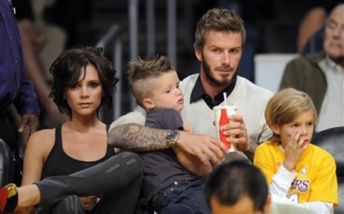 Victoria Beckham and David Beckham with their children