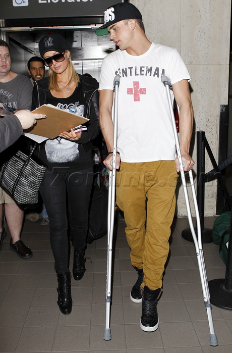 Paris Hilton at LAX with River Viiperi on crutches