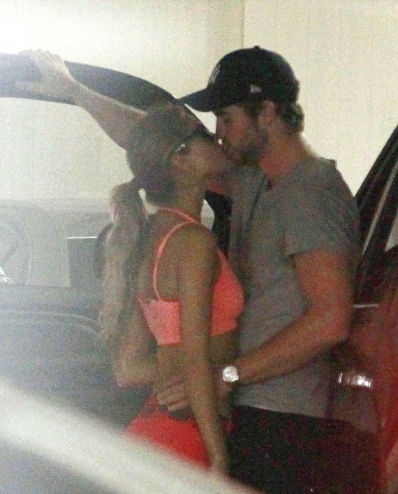 Liam Hemsworth likes his kisses well documented, apparently. (Pacific Coast News)